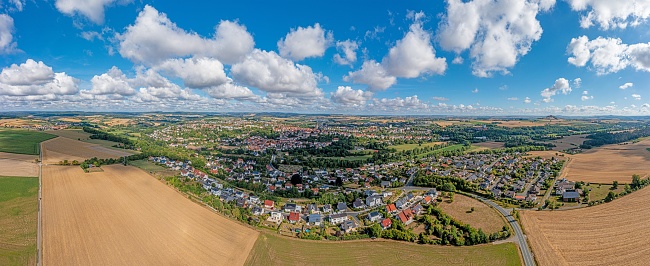 Drone panorama over German settlement Warburg in North Rhine-Westphalia during daytime in summer