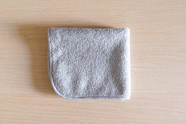 istock Wipe towel fold on wood table. 1414415342