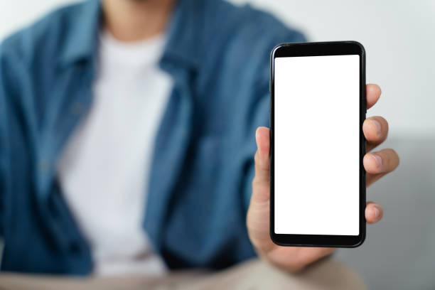 istock Man hand holding blank empty white screen smart phone. 1414416176