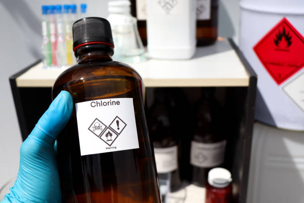 chlorine in bottle, chemical in the laboratory chlorine in bottle, chemical in the laboratory and industry chlorine stock pictures, royalty-free photos & images