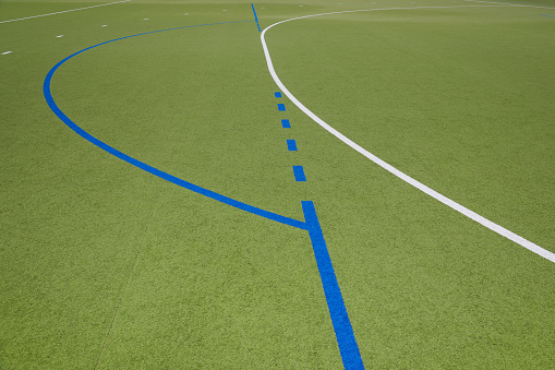 Hockey field with white and blue lines, no person