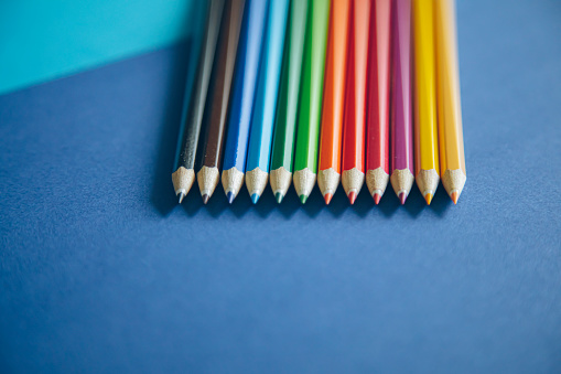 a row of used color pencils with one pecil standing out.similar photos from my portfolio.