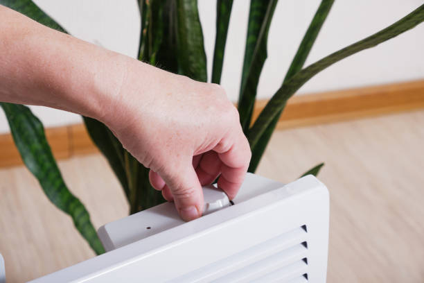 istock Using heater at home in winter. Heating season concept 1414426186