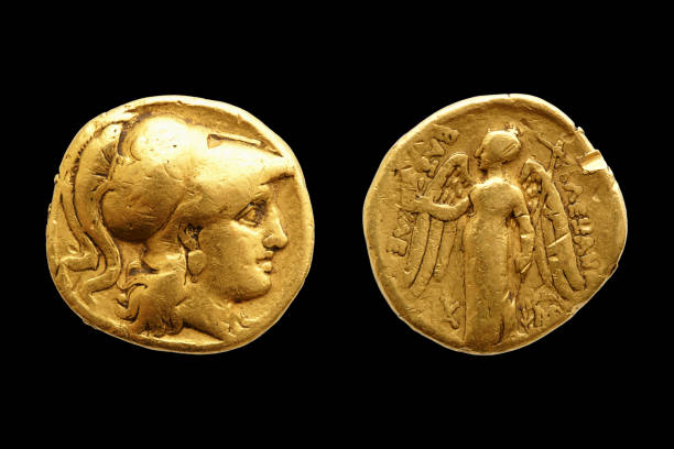 Ancient Greek Gold Coin Alexander The Great Two sides of an ancient greek gold coin with Alexander the Great isolated on black background. ancient coins of greece stock pictures, royalty-free photos & images