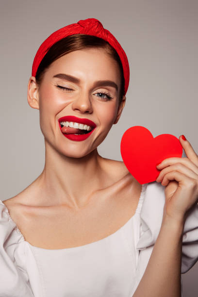 istock Beautiful emotional woman holding present box 1414431537