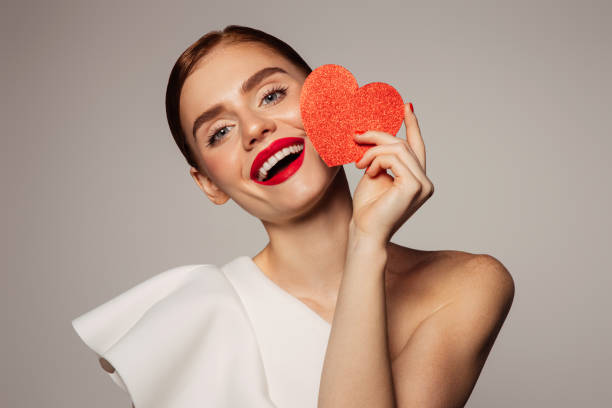 istock Beautiful emotional woman holding present box 1414432068