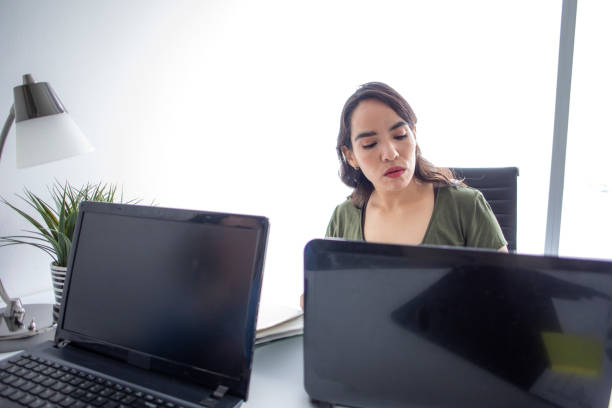 istock woman working in an office 1414432363