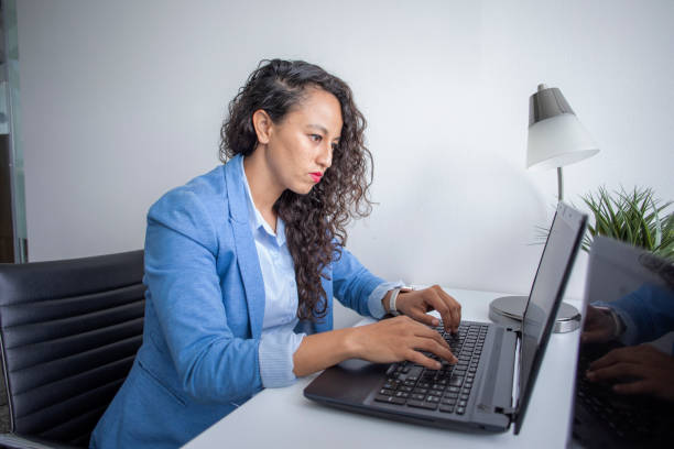istock woman working in an office 1414432375