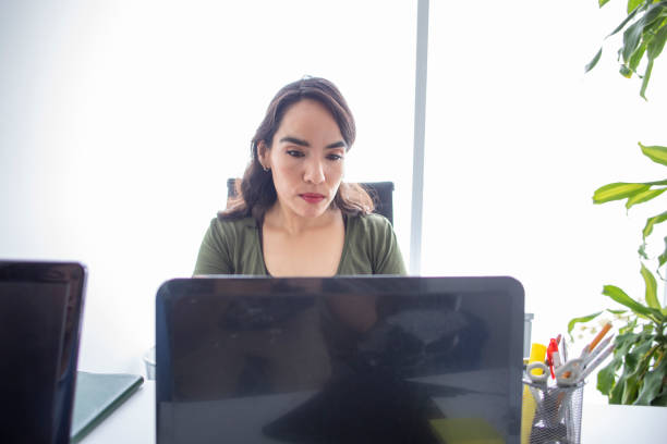 istock woman working in an office 1414432422