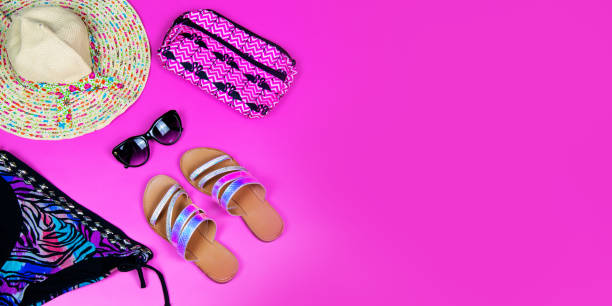istock Summer pink banner with hat ,sunglasses and bikini. Text space 1414437850