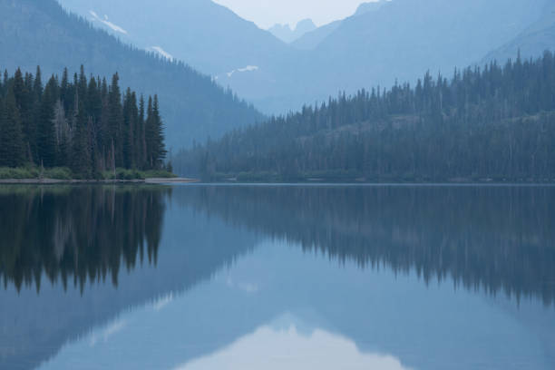 istock Converging Lines Through A Still Two Medicine Lake 1414439512
