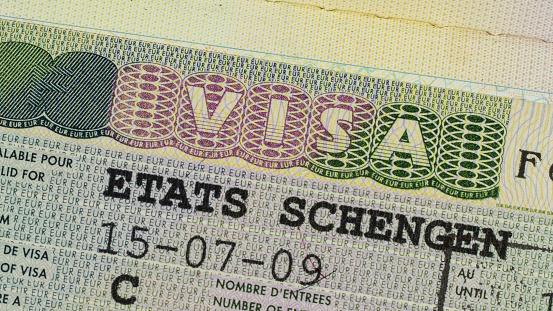 Schengen visa in the passport close-up.