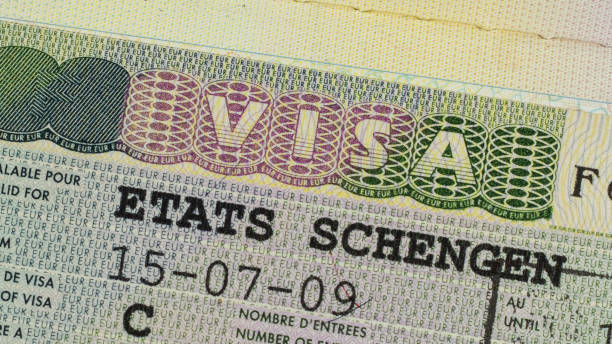Schengen visa in the passport close-up. stock photo