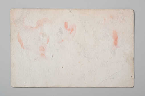 Ancient back of a postcard or photo cards on a gray background. Flat lay