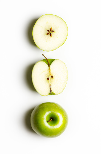 Three views of a green apple on white background.