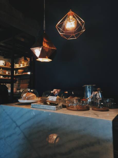 Modern interior style in cafe, black wall colour, sourdough bread, marble countertop