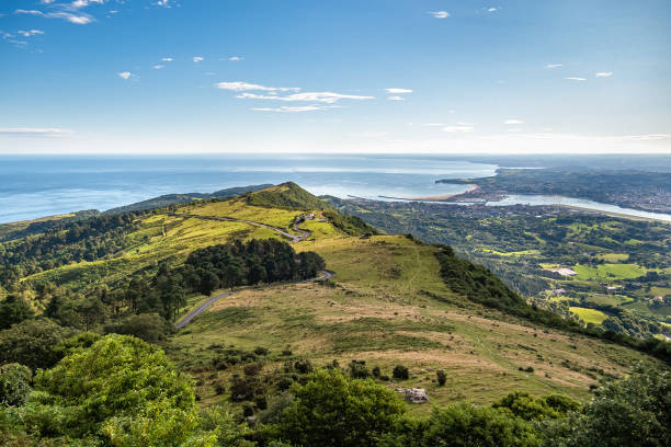 panoramic view of green hill, sea and town and border between spain and france. basque country on the early morning. - comunidade autónoma do país basco imagens e fotografias de stock