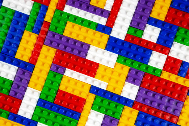 istock Abstract background texture of colored constructor blocks. Background of colorful plastic part of constructor. Pile of colored toy bricks. 1414446510