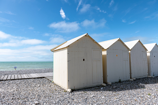 white traditional wooden beach huts at the beach in Cayeux-sur-Mer at the atlantic coast