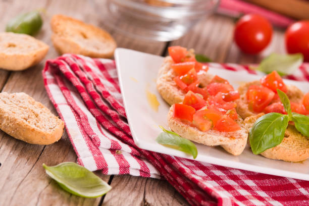 istock Friselle with cherry tomatoes and basil. 1414449820