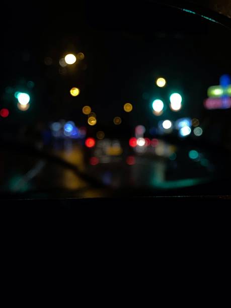 istock Blurry image of lights at night from inside of car 2 1414450089