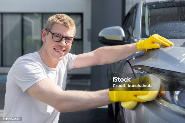Happy Dad Wash And Clean An Automative Car At Home Garage With Water Jet And Shampoo Wax On Weekend Stock Photo - Download Image Now