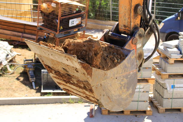 istock Shovel from an excavator is filled with earth 1414452975