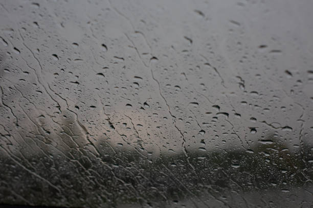 istock blurred background raindrops window concept weather hurricane 1414453307