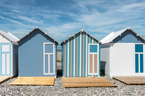 colorful traditional wooden beach huts at the beach in Cayeux-sur-Mer at the atlantic coast