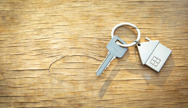 istock House keys on wooden background. 1414455428