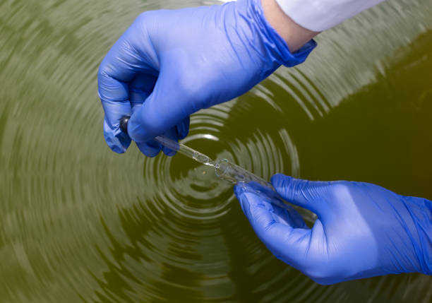 Water sample. Treatment facilities. Quality control of water that has been purified and processed. The laboratory assistant collects material for research. Liquid in a test tube. Sewage treatment stock photo
