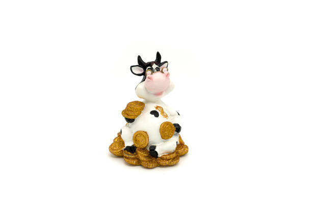 istock Souvenir Cow Figurine on White Background 1414455796