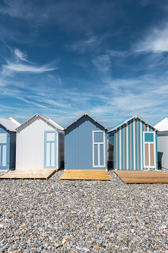 colorful traditional wooden beach huts at the beach in Cayeux-sur-Mer at the atlantic coast