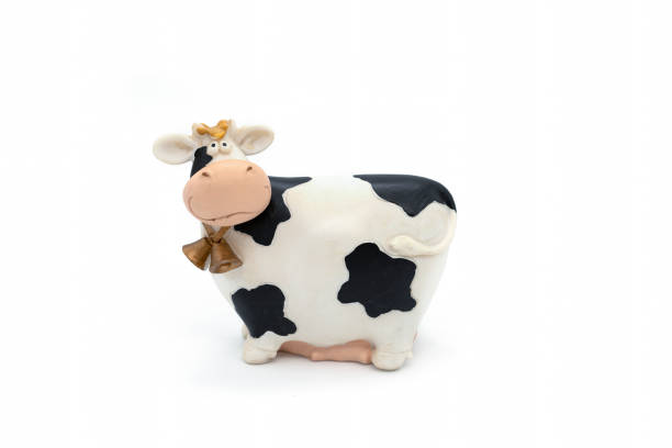istock Souvenir Cow Figurine on White Background 1414458226