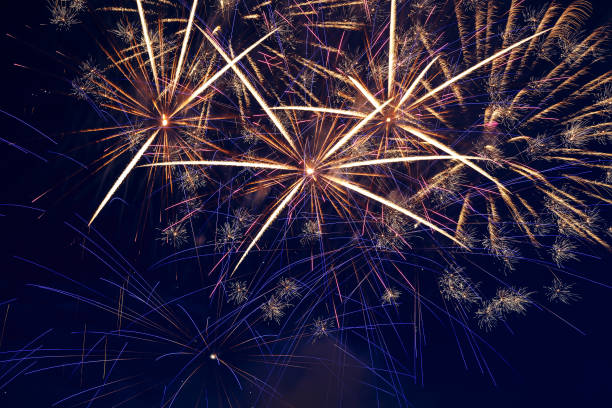 istock Colorful fireworks in the night sky. Festive pyrotechnics. Background image. 1414458910