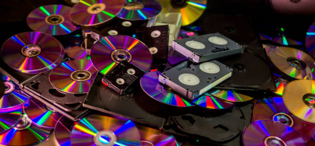 a many compact discs and some hi-8, vhs and dv-cam video casettes - hi8 imagens e fotografias de stock