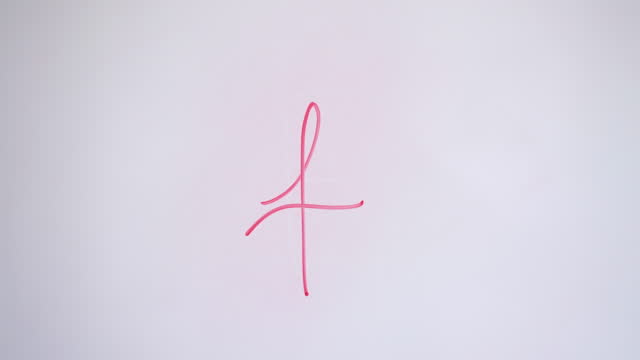Hand Writing Lowercase Letter f On White Board With Red Marker
