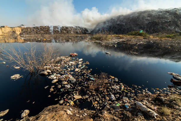 istock Landfill with burning trash piles 1414464752
