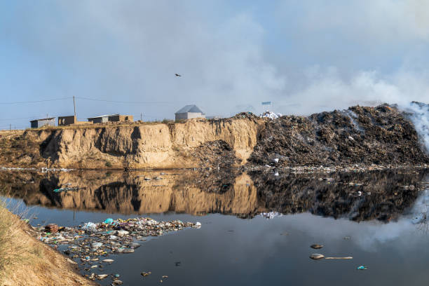 istock Landfill with burning trash piles 1414464837