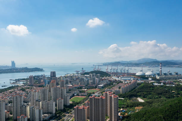 istock seaside city under blue sky and white clouds 1414464963