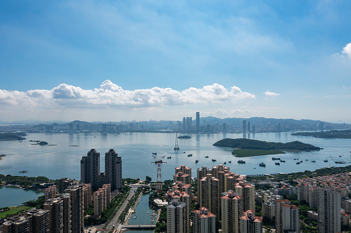 seaside city under blue sky and white clouds