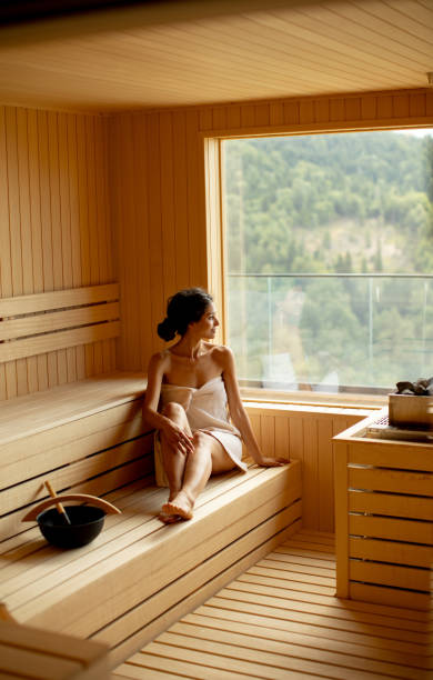 istock Young woman relaxing in the sauna 1414466346