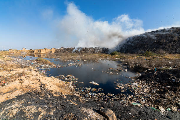 istock Landfill with burning trash piles 1414466465
