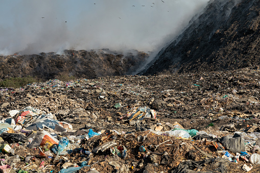 Landfill with burning trash piles
