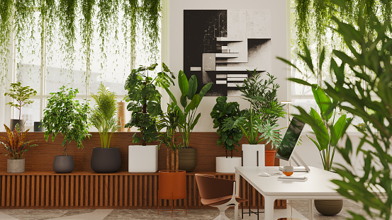 Inside a sustainable green workplace or home office. All items in the scene are 3D, paintings are computer generated