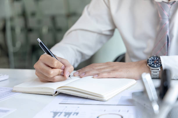 istock Midsection Of Businessman Working At Office 1414478850