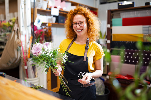 Young woman working in a flower shop