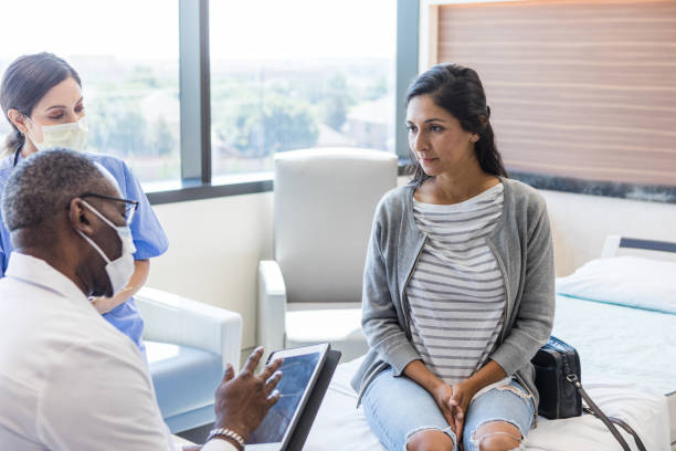 istock Doctor talks to the female patient 1414481907