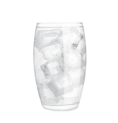 Glass of soda water with ice isolated on white