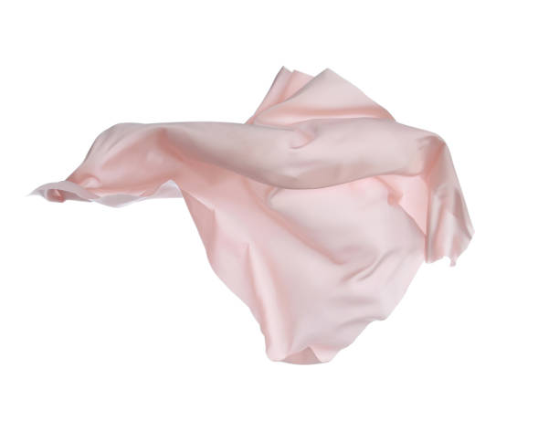 istock Beautiful light pink silk floating on white background 1414484277
